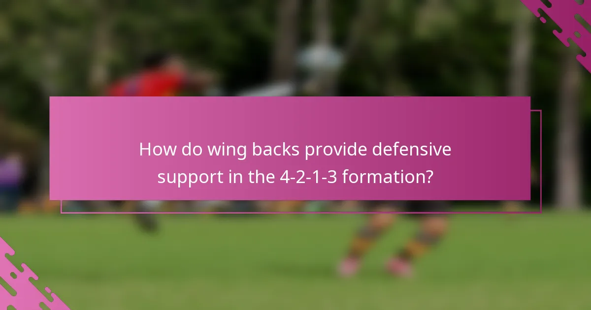 How do wing backs provide defensive support in the 4-2-1-3 formation?